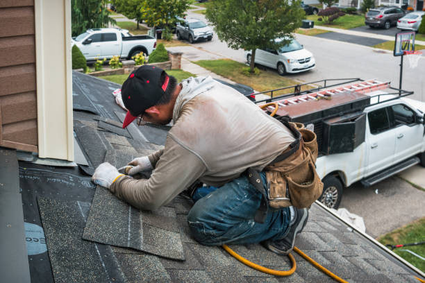 Professional Roofing technician working in Tate, GA